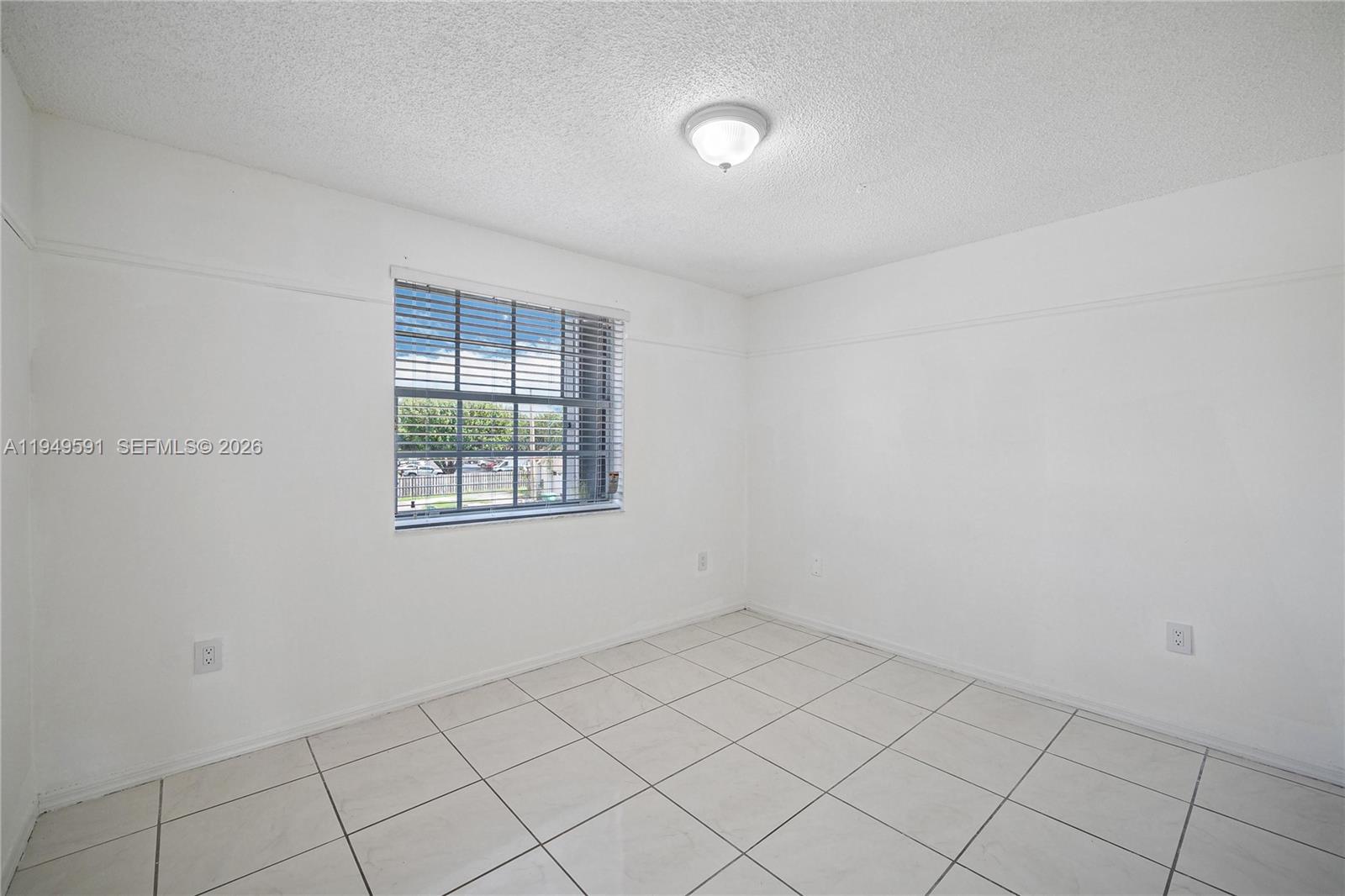 14340 Southwest 90th Street Miami, FL 33186 - Photo 23 of 34 an empty room with windows