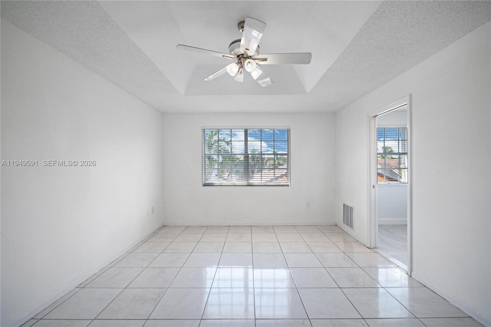 14340 Southwest 90th Street Miami, FL 33186 - Photo 24 of 34 a view of an empty room with a window