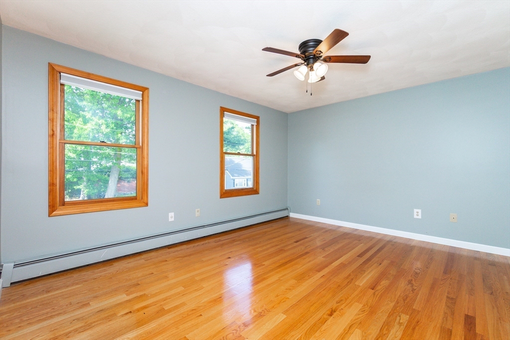 63 Bow Street Saugus, MA 01906 - Photo 20 of 42 wooden floor in an empty room with a window