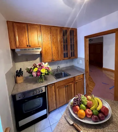 a kitchen with a stove and cabinets