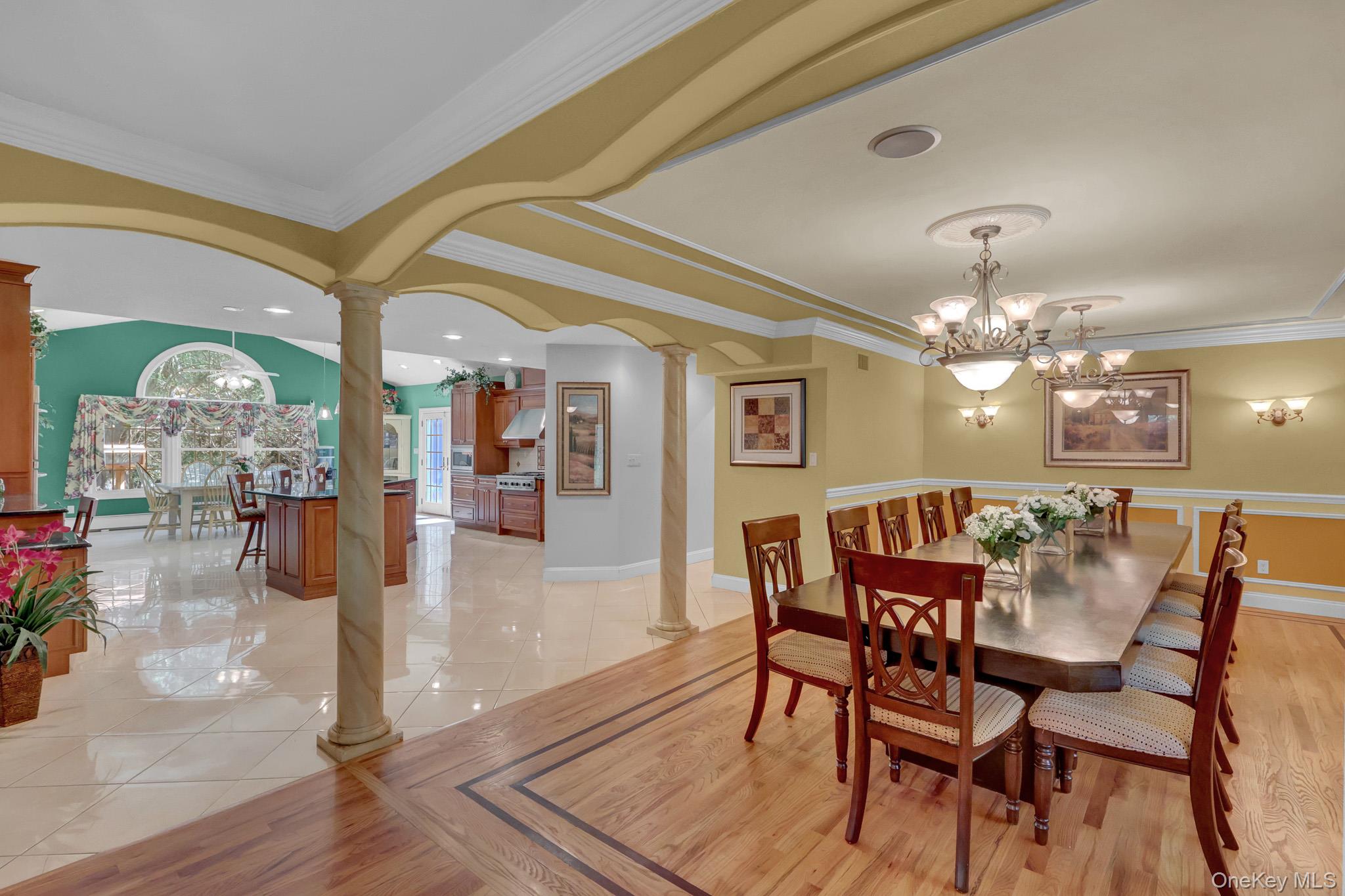 15 Stillwater Road Nissequogue, NY 11780 - Photo 15 of 43 Formal dining room featuring hardwood flooring with a decorative inlay border and a multi-light chandelier