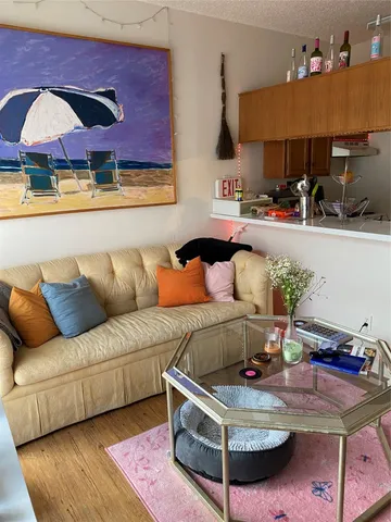 a room with furniture and a potted plant