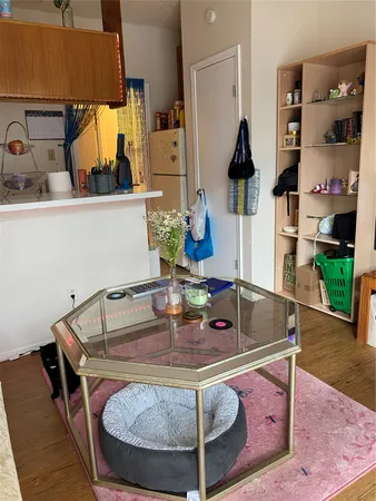 a kitchen with a stove a microwave and cabinets