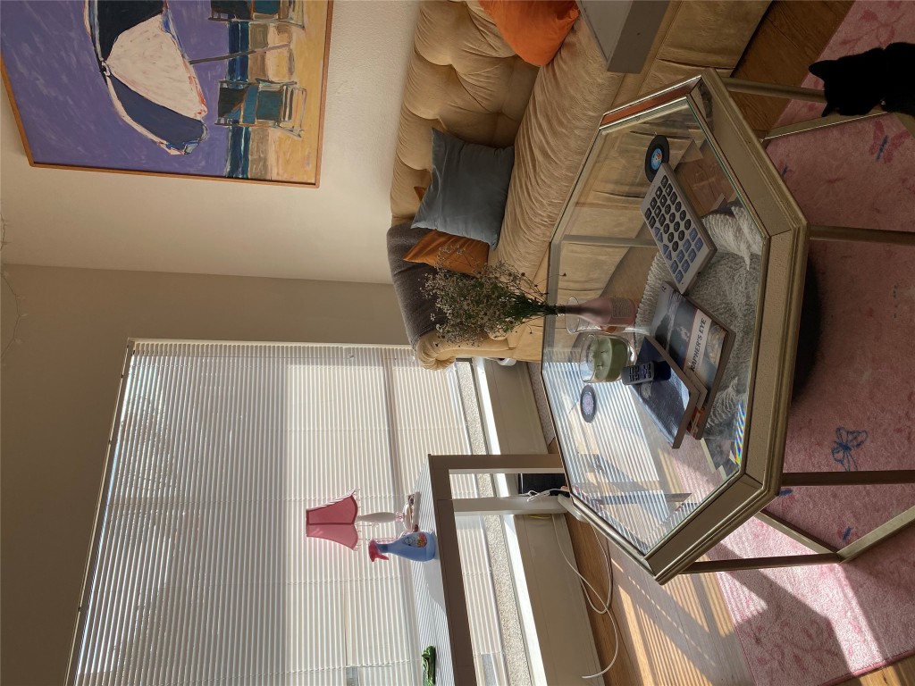 1905 San Gabriel Street, Unit 103 Austin, TX 78705 - Photo 14 of 21 a living room with furniture and wooden floor
