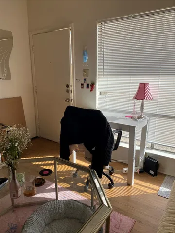 a white toilet sitting next to a shower curtain