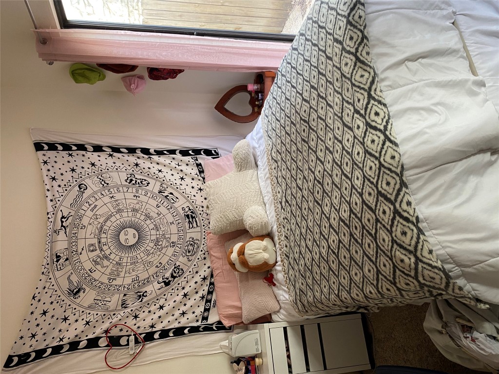 1905 San Gabriel Street, Unit 103 Austin, TX 78705 - Photo 20 of 21 a bedroom with a bed and a window