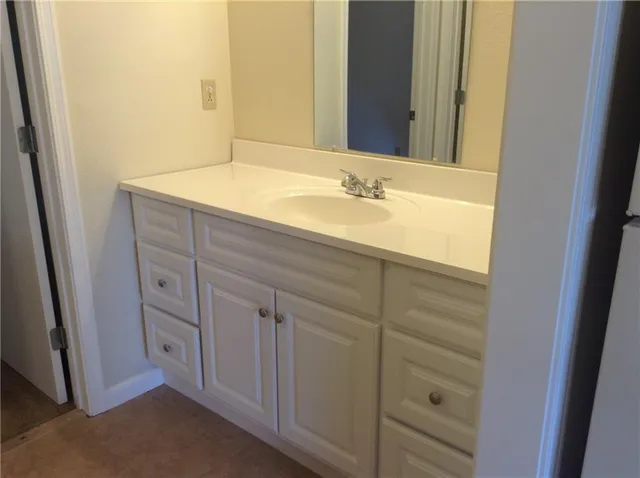 a bathroom with a sink a toilet and bathtub
