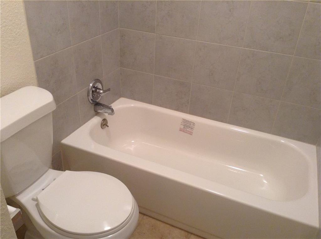 1905 San Gabriel Street, Unit 103 Austin, TX 78705 - Photo 8 of 21 a bathroom with a sink a toilet and bathtub