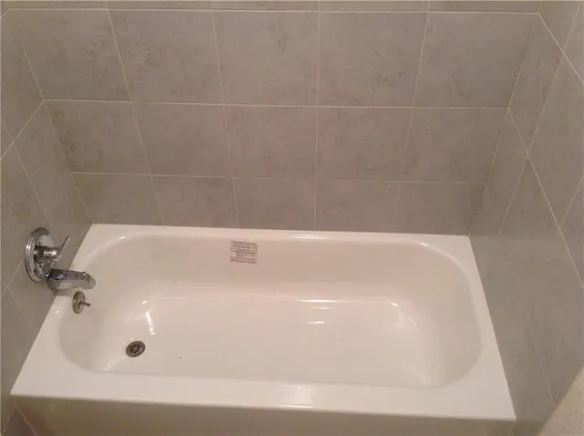 a living room with furniture and a chair