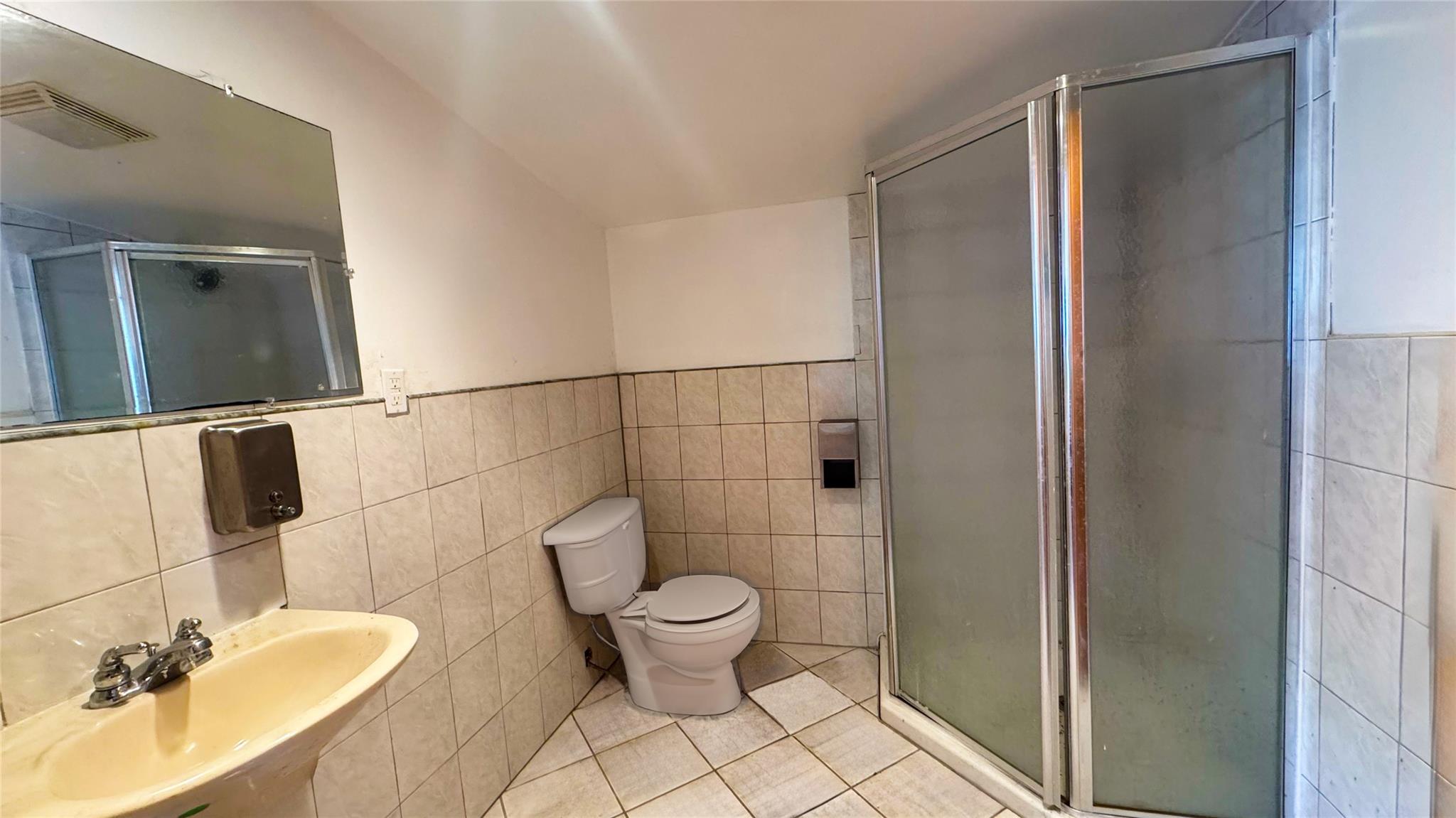 892 Bowbell Road Greene, NY 13778 - Photo 18 of 35 Full bath featuring tile patterned flooring, a shower stall, and tile walls