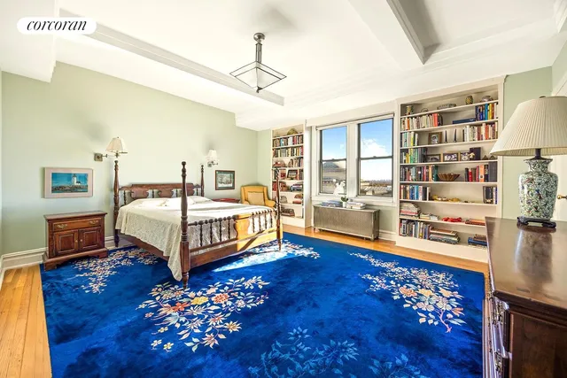 a bedroom with furniture and a window