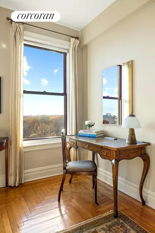 a living room with furniture a rug and a chandelier