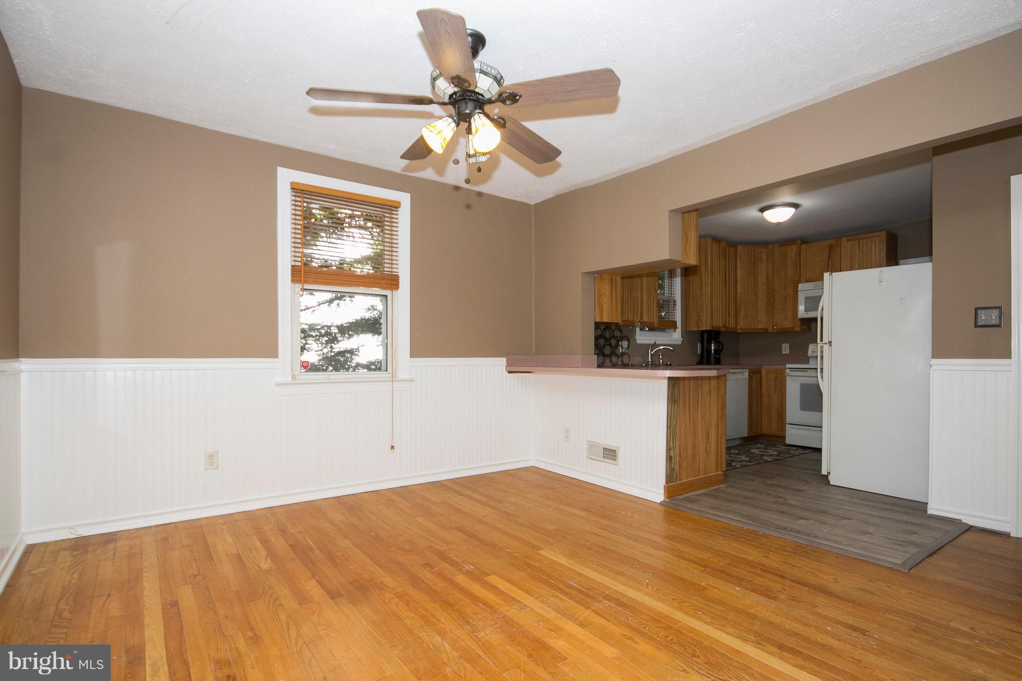 1713 Brookview Road Dundalk, MD 21222 - Photo 3 of 21 a kitchen with stainless steel appliances kitchen island granite countertop a refrigerator and a sink