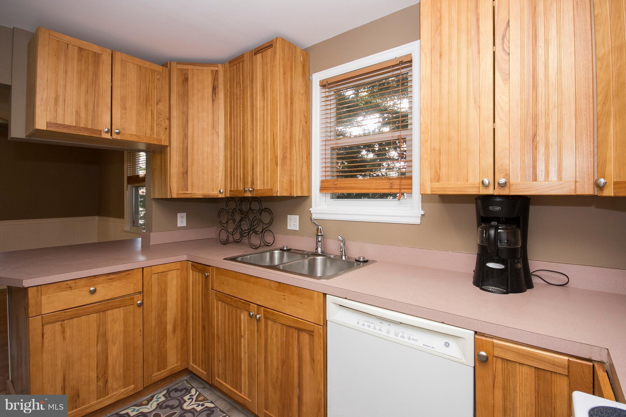 1713 Brookview Road Dundalk, MD 21222 - Photo 8 of 21 a kitchen with stainless steel appliances granite countertop a sink a stove and a microwave