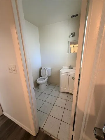 a view of a room with wooden floor and stairs