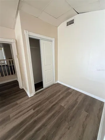a view of an entryway with wooden floor