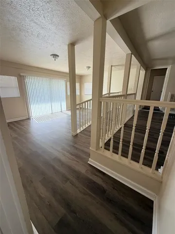 a view of a house with wooden deck