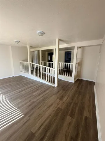 an entryway with wooden floor