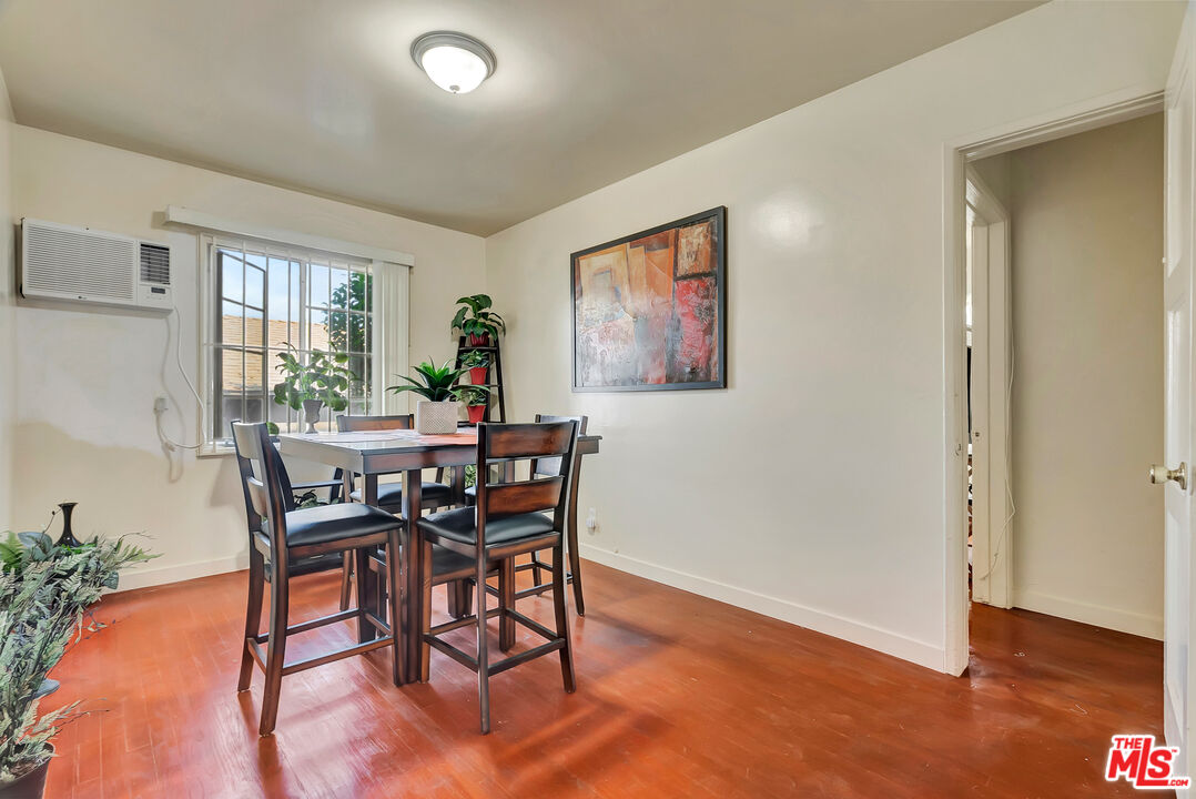 4034 Abourne Road, Unit B Los Angeles, CA 90008 - Photo 12 of 16 a view of a dining room with furniture window and wooden floor