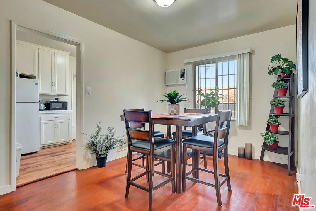 4034 Abourne Road, Unit B Los Angeles, CA 90008 - Photo 13 of 16 a view of a dining room with furniture and wooden floor