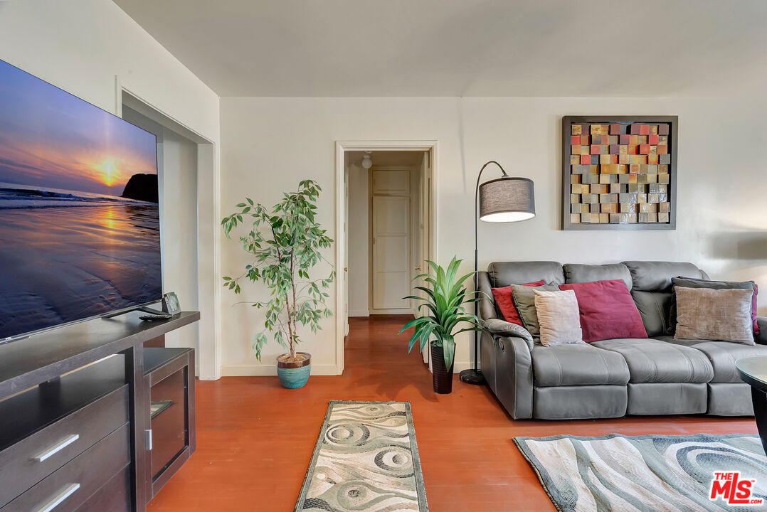 4034 Abourne Road, Unit B Los Angeles, CA 90008 - Photo 4 of 16 a living room with furniture and a flat screen tv