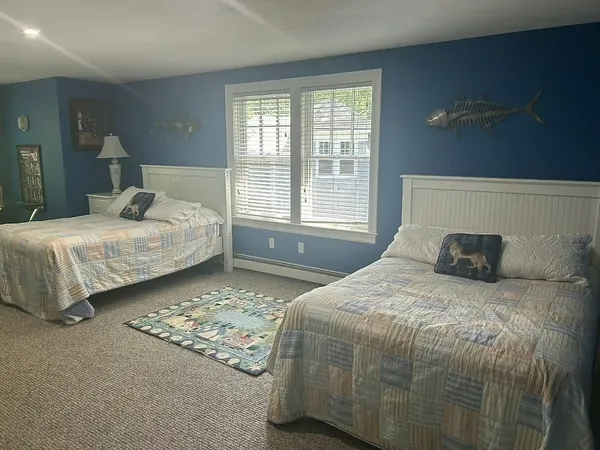 a bedroom with bed and window