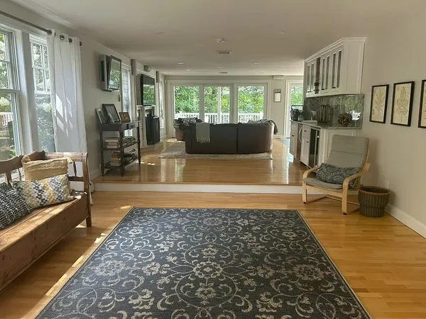 a living room with furniture and a rug