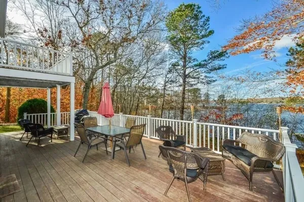 a view of a chair and table on the deck