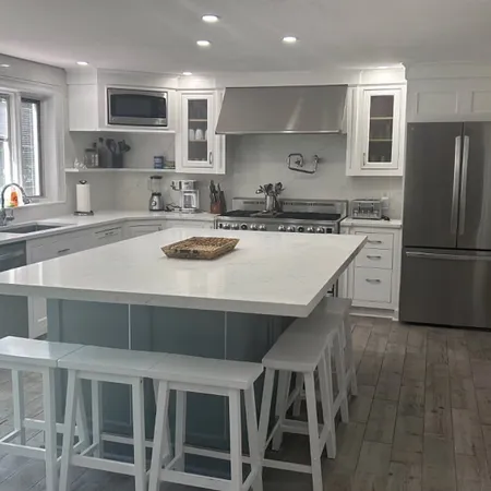 a kitchen with a stove a sink and a refrigerator