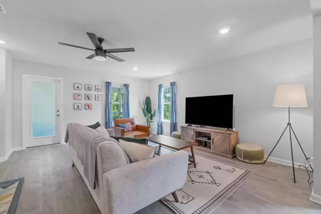 a living room with furniture and a flat screen tv