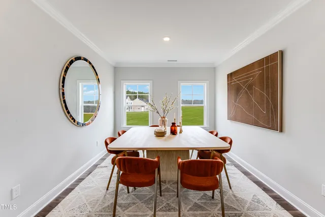 a room with a mirror and a wooden floor