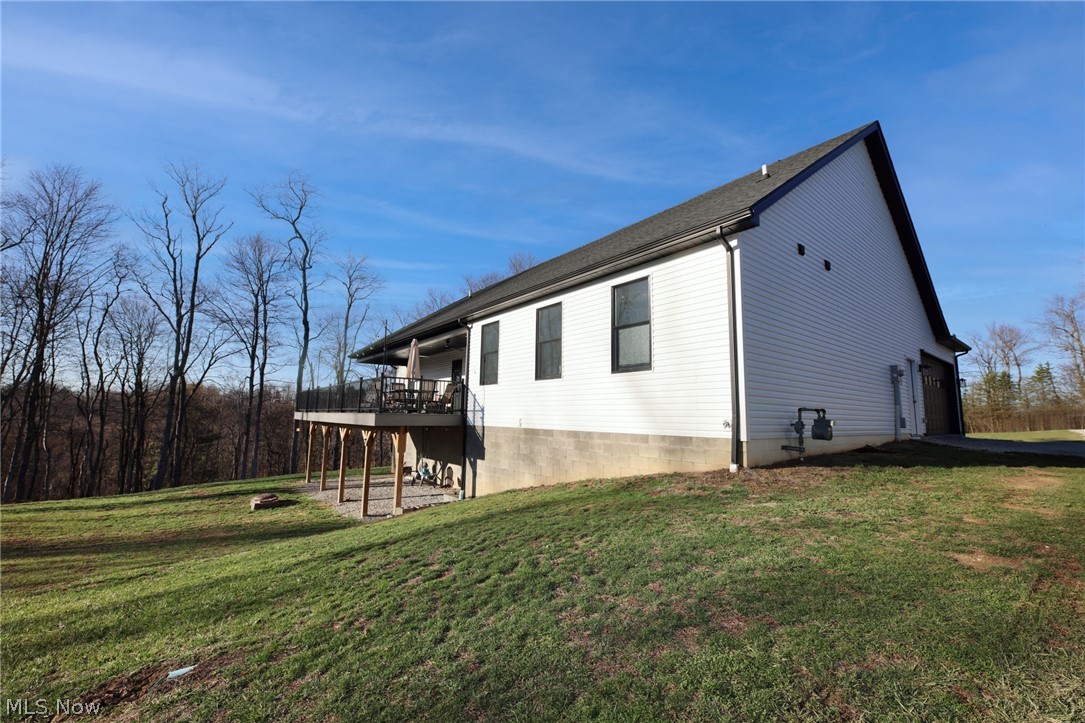 258 Friendly Acres Road Wellsburg, WV 26070 - Photo 30 of 47 Side view of home featuring a lawn, and a deck