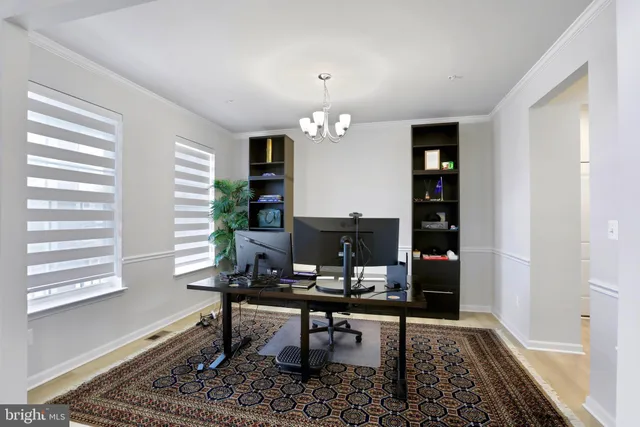 a workspace with furniture and a window