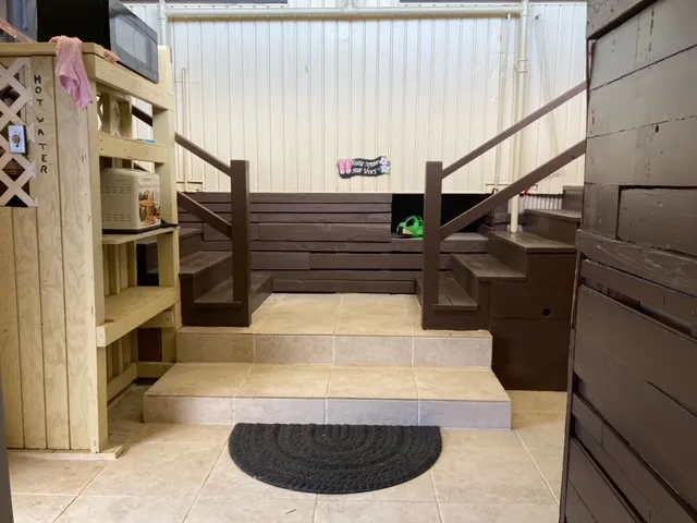 a kitchen with stainless steel appliances granite countertop a refrigerator and a stove