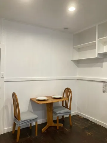 a view of a chair and table in a room