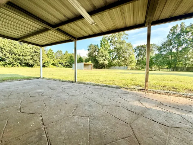 a view of an empty room with a yard