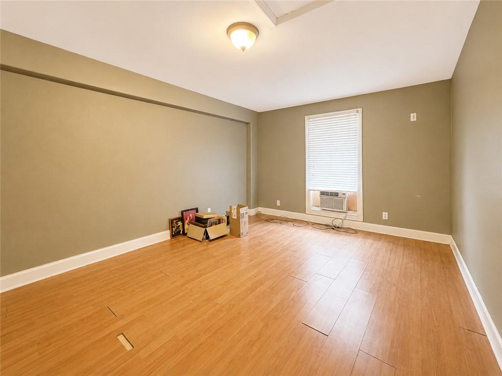 212 Craigtown Road Northeast Calhoun, GA 30701 - Photo 13 of 21 an empty room with window and a wooden floor