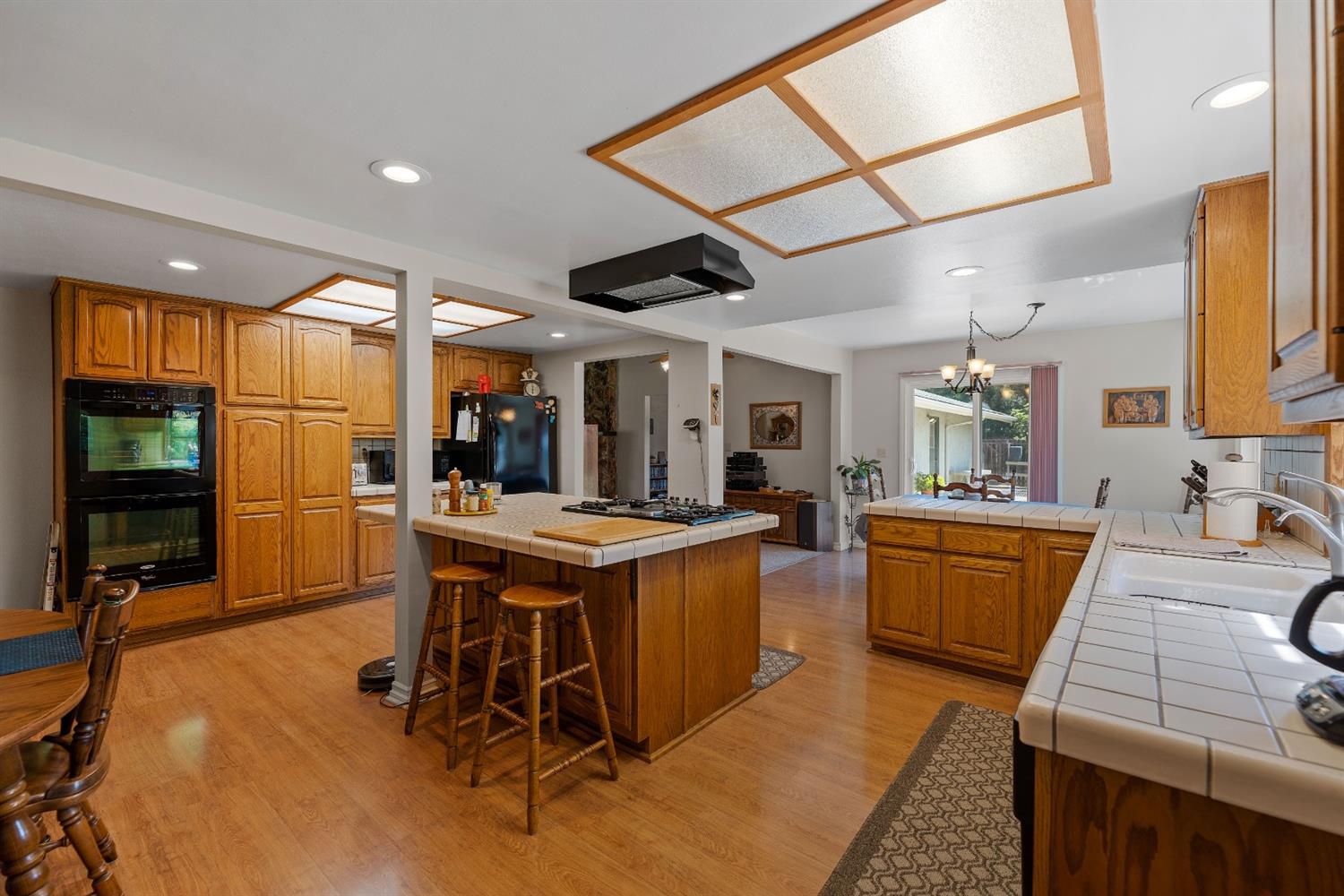 488 South Rice Road Ojai, CA 93023 - Photo 12 of 23 a kitchen with stainless steel appliances granite countertop a sink a stove and a refrigerator