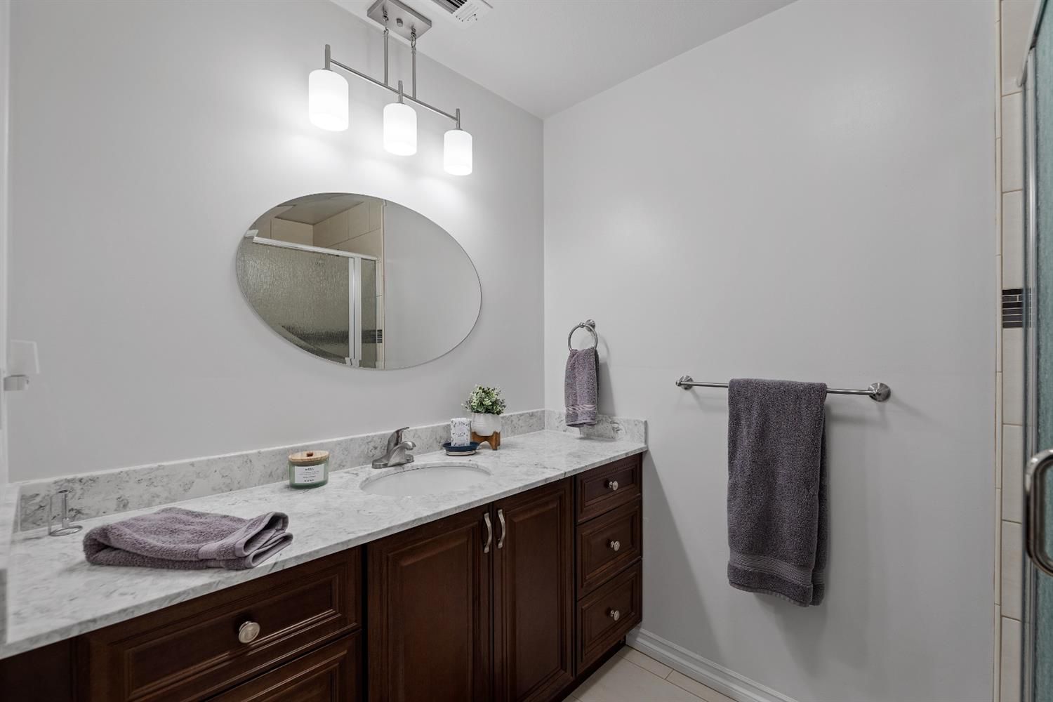 488 South Rice Road Ojai, CA 93023 - Photo 15 of 23 a bathroom with a granite countertop sink and a mirror