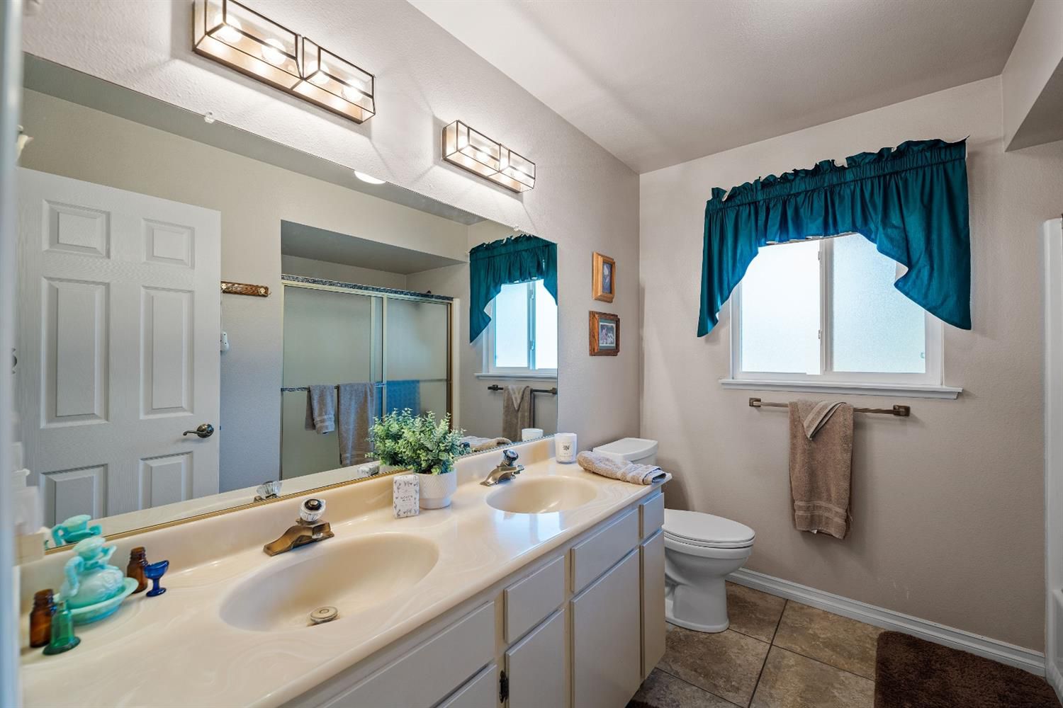 488 South Rice Road Ojai, CA 93023 - Photo 16 of 23 a bathroom with a sink toilet and mirror