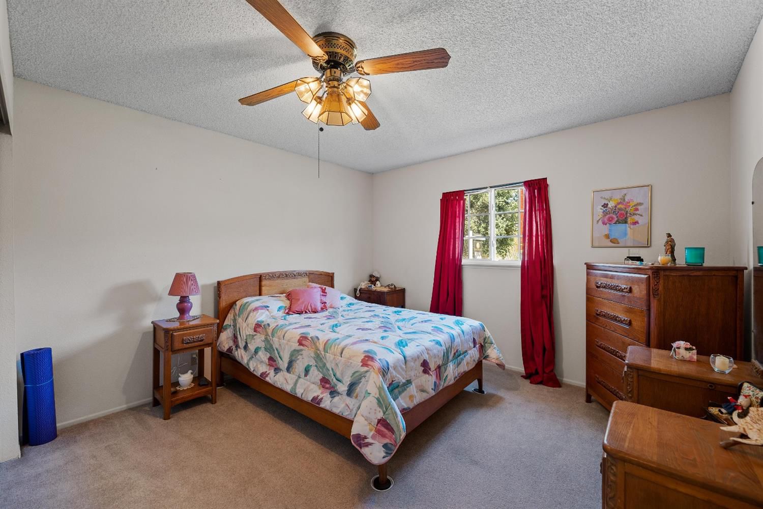 488 South Rice Road Ojai, CA 93023 - Photo 17 of 23 a bedroom with a bed and a chandelier