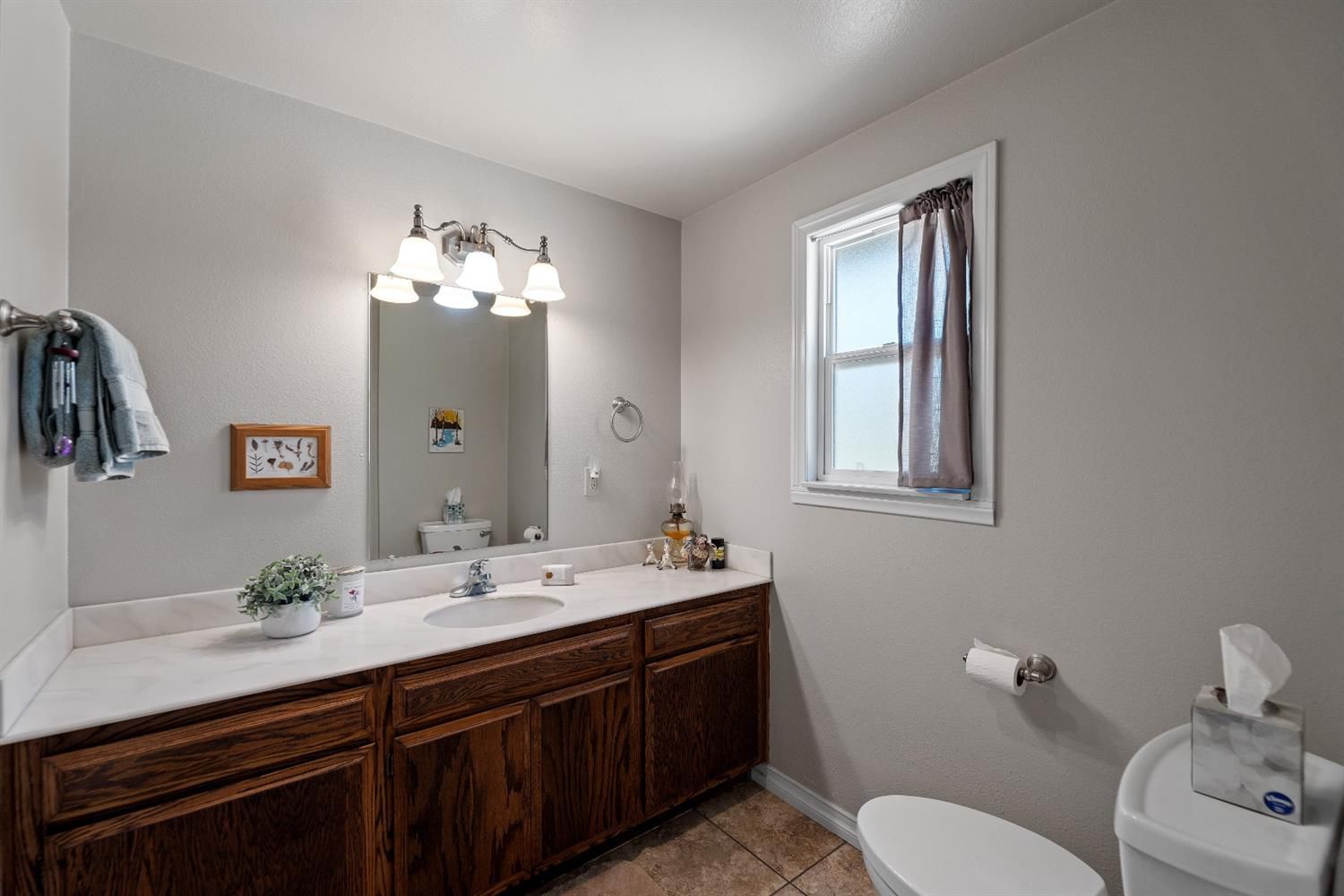 488 South Rice Road Ojai, CA 93023 - Photo 20 of 23 a spacious bathroom with a double vanity sink toilet and a mirror