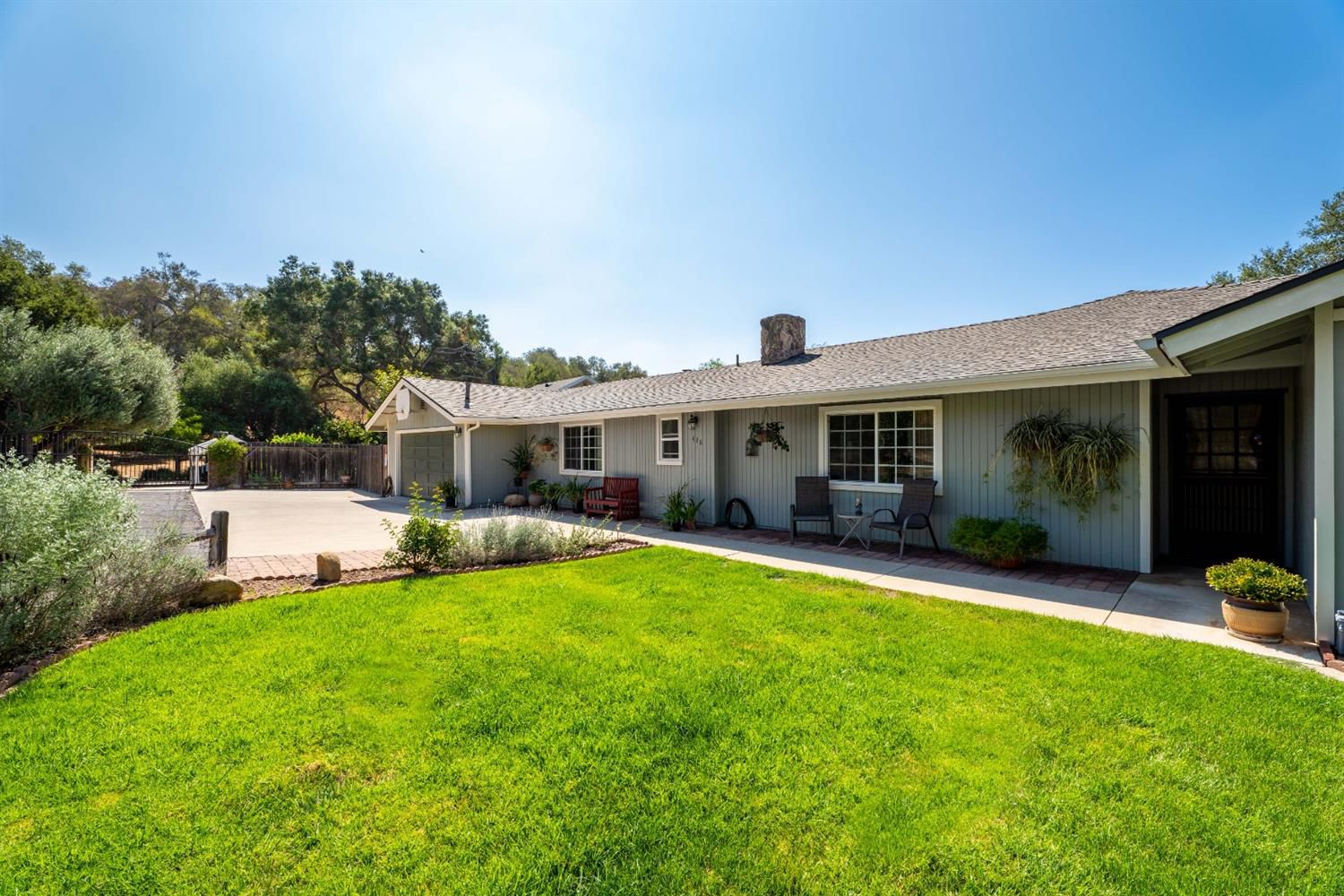 488 South Rice Road Ojai, CA 93023 - Photo 4 of 23 a front view of a house with a garden and porch