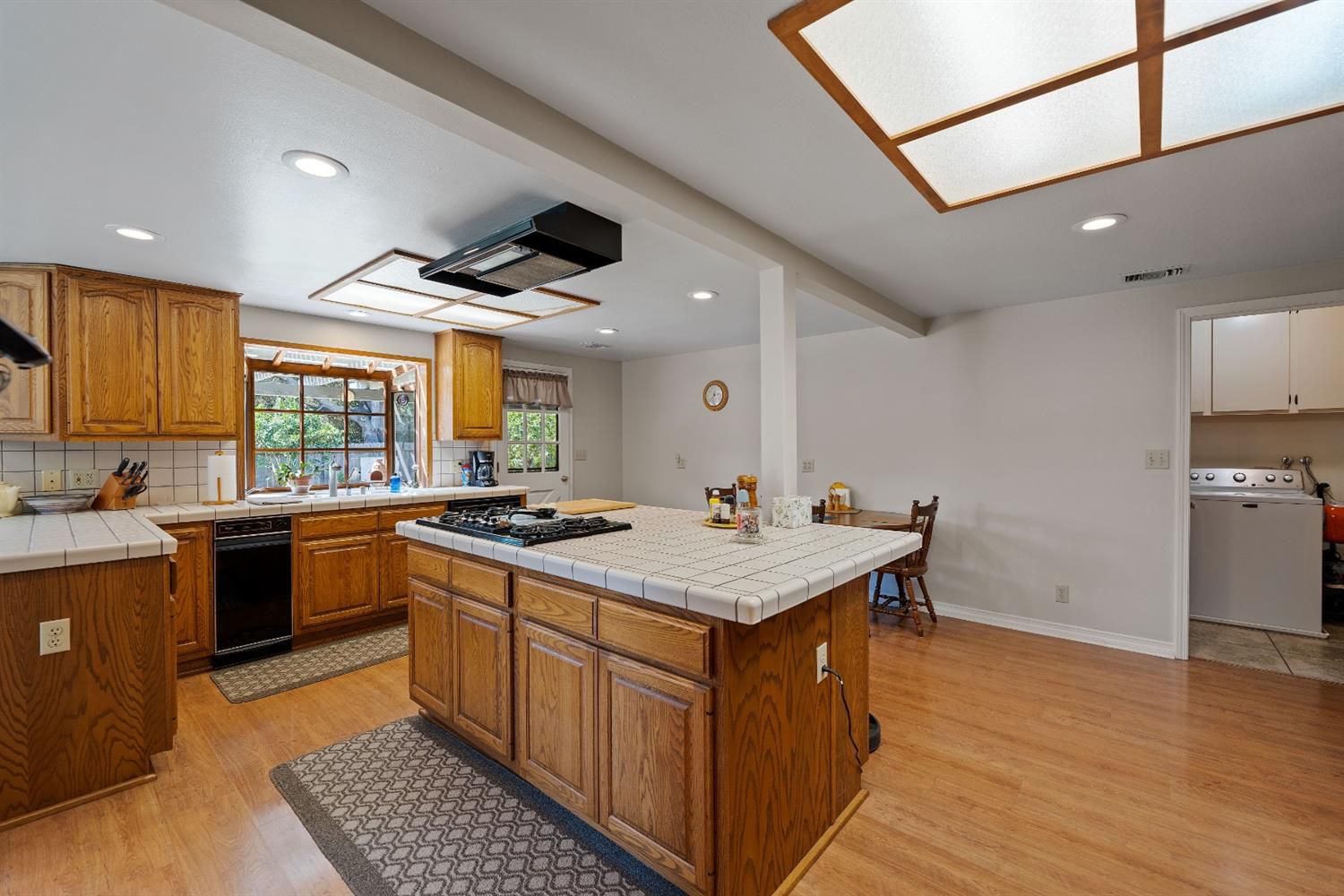 488 South Rice Road Ojai, CA 93023 - Photo 10 of 23 a kitchen with stainless steel appliances granite countertop a stove a sink dishwasher and a refrigerator