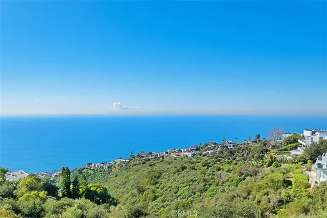 a view of a living room and kitchen with furniture wooden floor and window