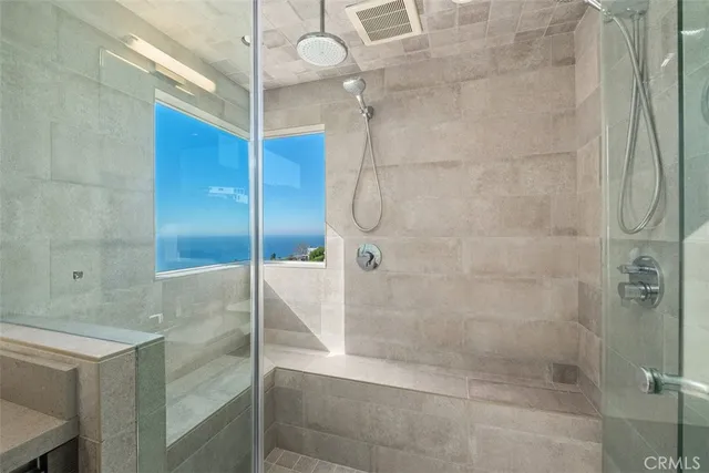 a kitchen with stainless steel appliances kitchen island granite countertop a stove a sink and a refrigerator