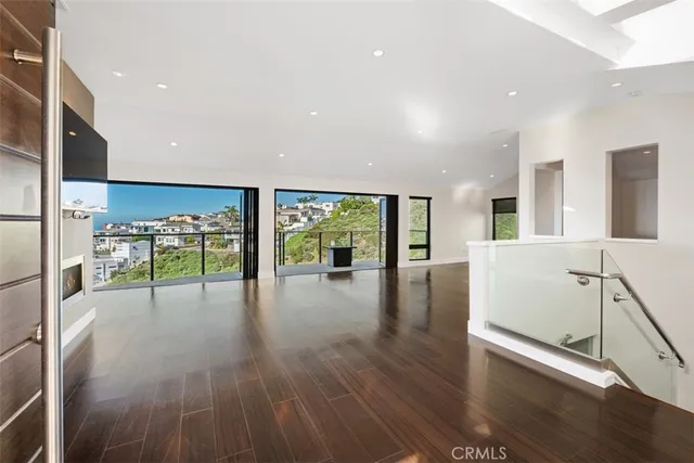 a view of a living room a flat screen tv and a fireplace
