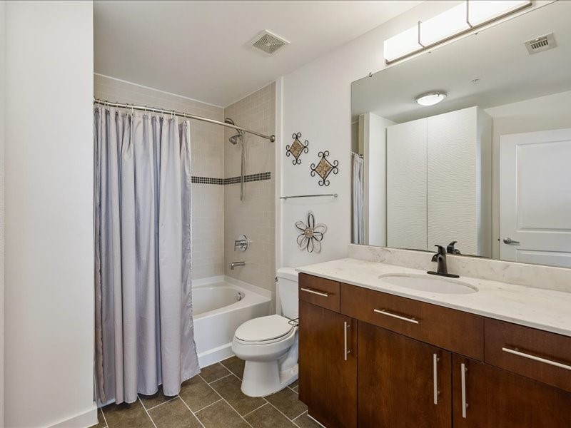 5925 Almeda Road, Unit 11901 Houston, TX 77004 - Photo 15 of 36 The secondary bathroom features modern cabinetry, sleek countertops, and contemporary fixtures. Clean lines and neutral finishes create a timeless look while offering comfort and convenience