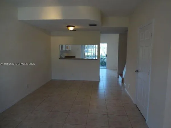 a view of entryway with kitchen