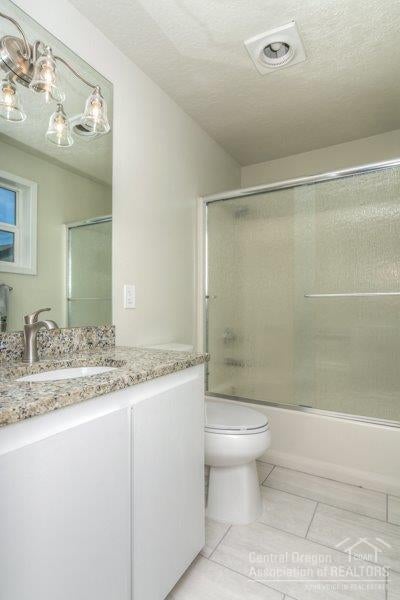 611 Southwest 25th Street Redmond, OR 97756 - Photo 15 of 23 One of the master bathrooms with tile fl